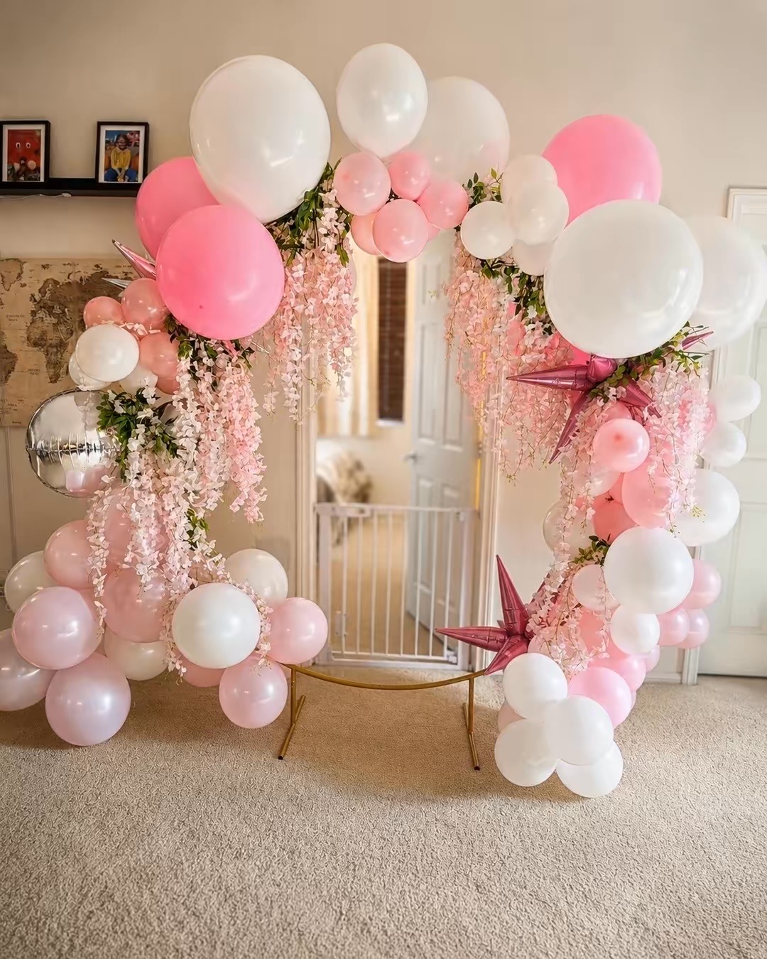 Pink and white circular balloon arch created by Moments by AMMI